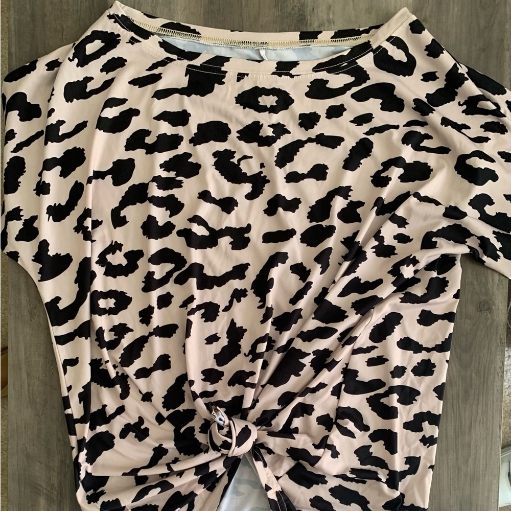 Women’s size large animal, print blouse can be worn tied in the front or down